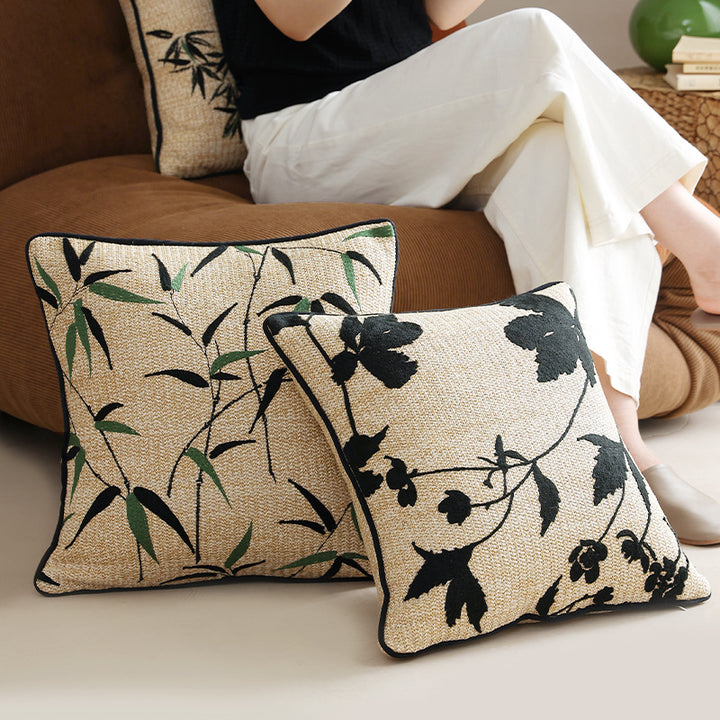 Square decorative pillow with embroidered bamboo design and natural linen texture