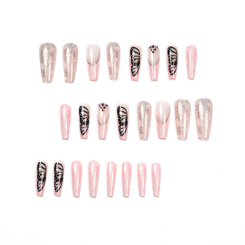 Glamorous nail extensions with beautiful butterfly motifs and glitter accents Kalsten