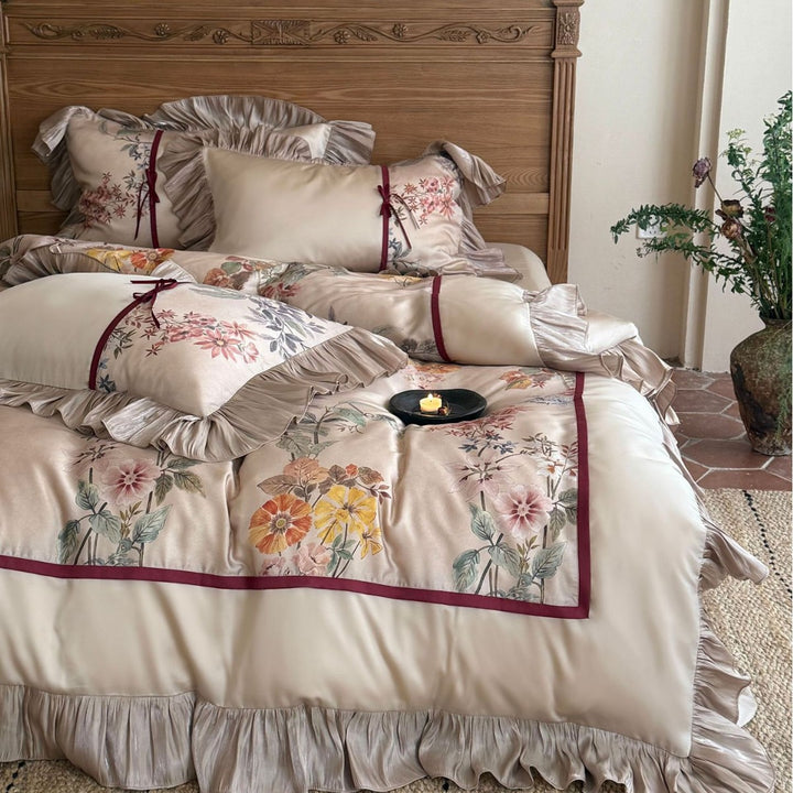Romantic satin bedding set with ruffles, floral embroidery and reversible function