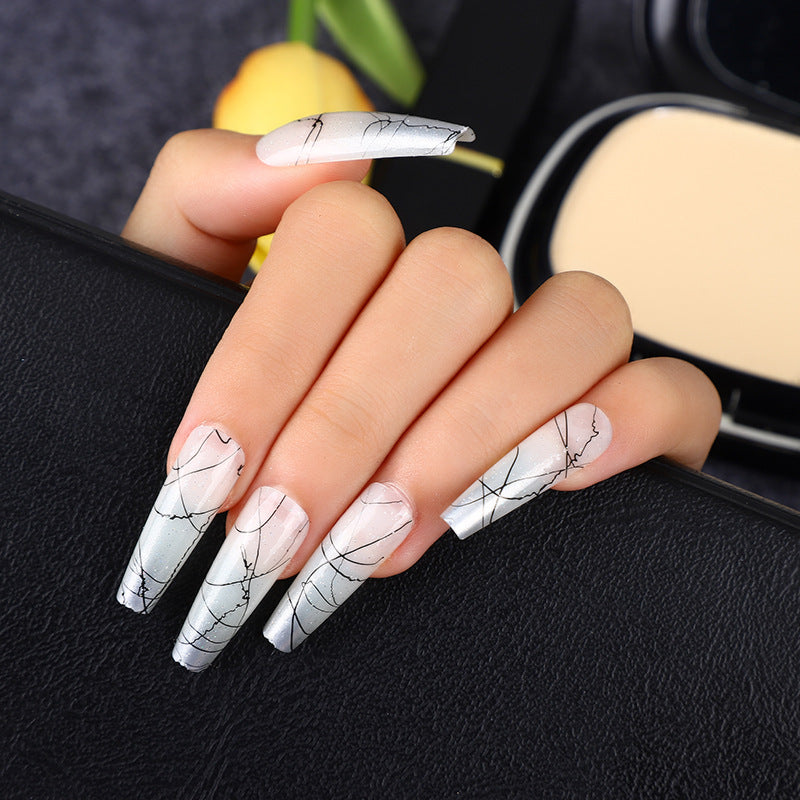 Artificial nails in modern ombre design with marbled accents Kalsten