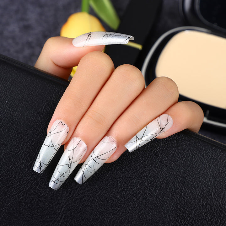 Artificial nails in modern ombre design with marbled accents Kalsten