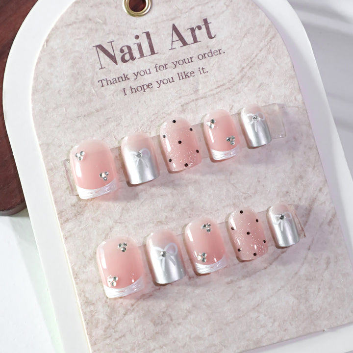 Artistic Nail Art with Bow and Glitter Accents Kalsten