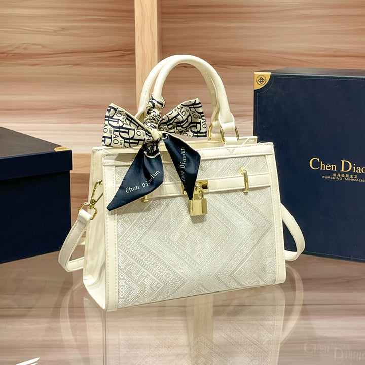 Elegant Designer Handbag with Decorative Bow