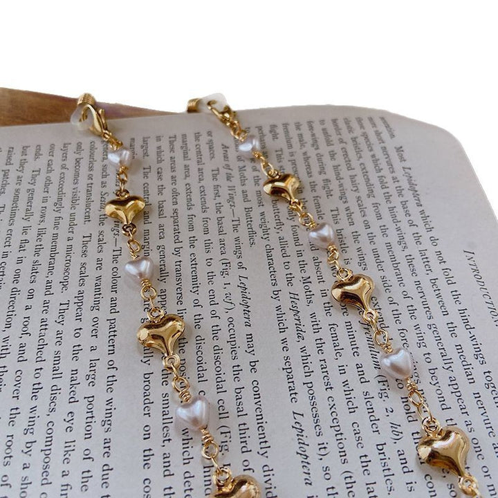 Fashionable necklace with pearls and golden accents Kalsten