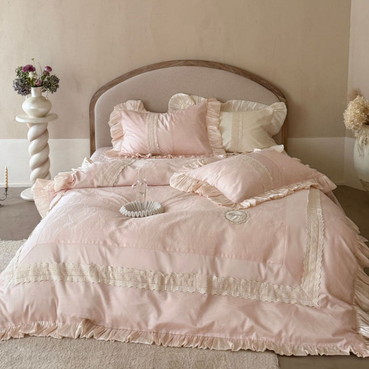 Duvet cover set with ruffle trim, fine lace border, and subtle jacquard structure