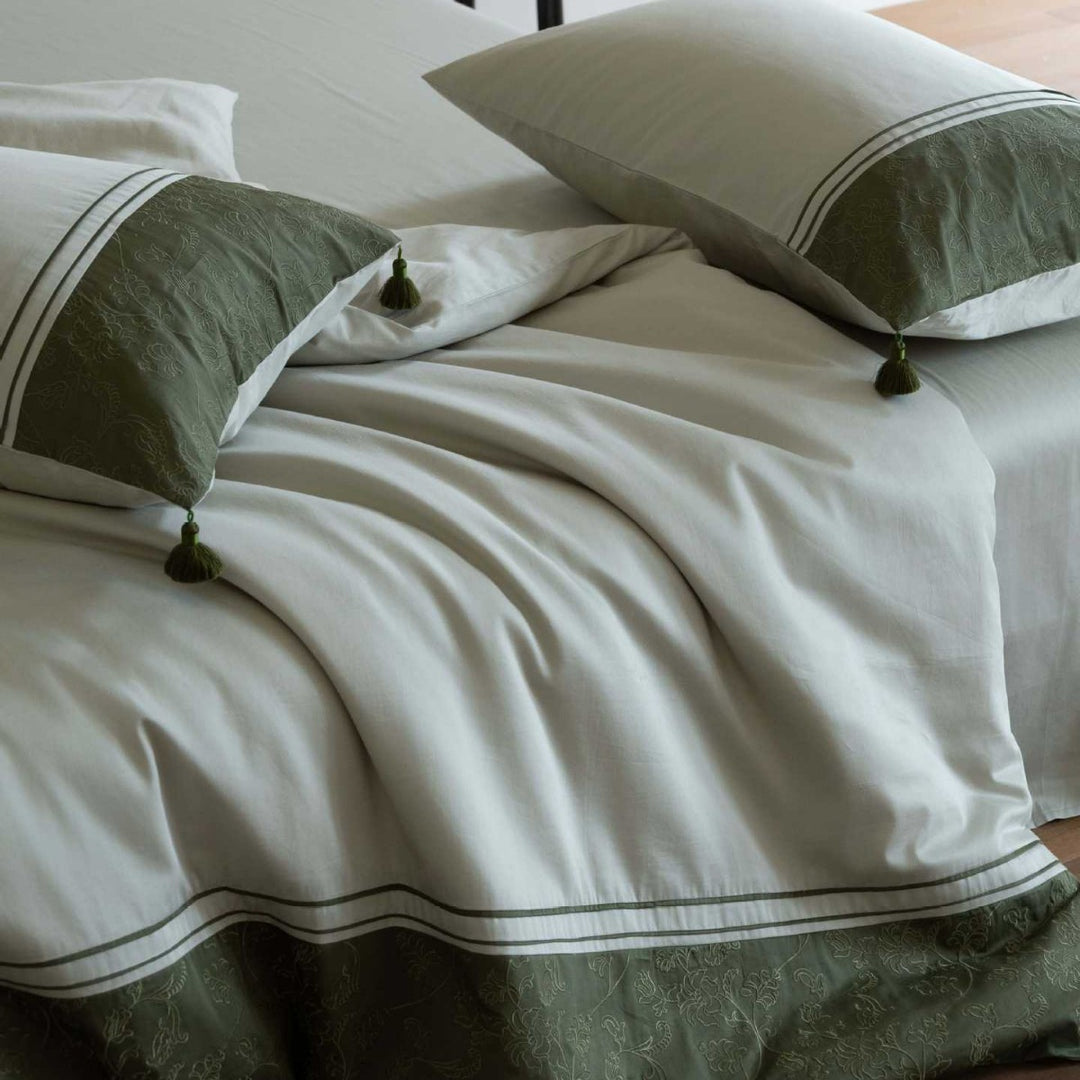 Luxurious cotton satin bedding set with decorative borders and decorative pillows