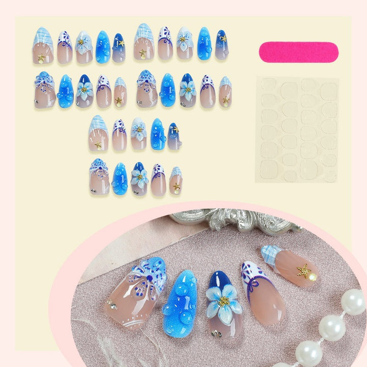 Artificial nail set with maritime designs and floral accents Kalsten
