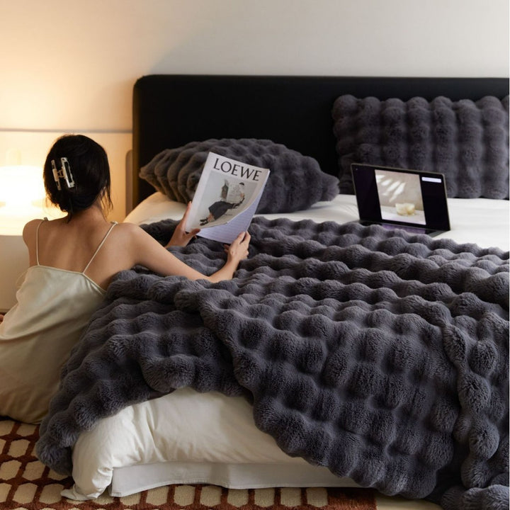 Cozy artificial fur throw blanket with wave structure and extra soft texture