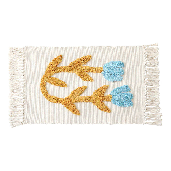 Decorative cotton bath mat with fringes and textured floral border