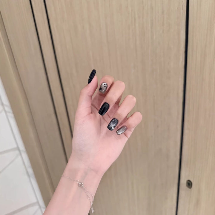 Artistic Press-On Nail Design with Metallic Accents