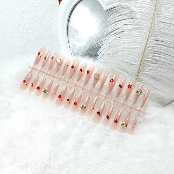 Glamorous artificial nails with shimmering embellishments Kalsten
