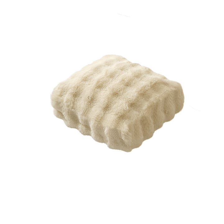 Plush floor cushion pouf with padded filling and faux fur cover