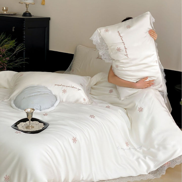 Luxurious satin bedding set with lace trim and snowflake embroidery