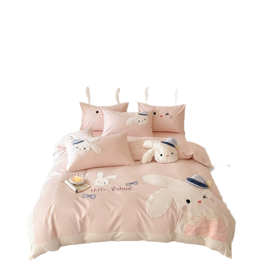 Children's bedding set with three-dimensional ears, plush pillow, and embroidered rabbit appliqués