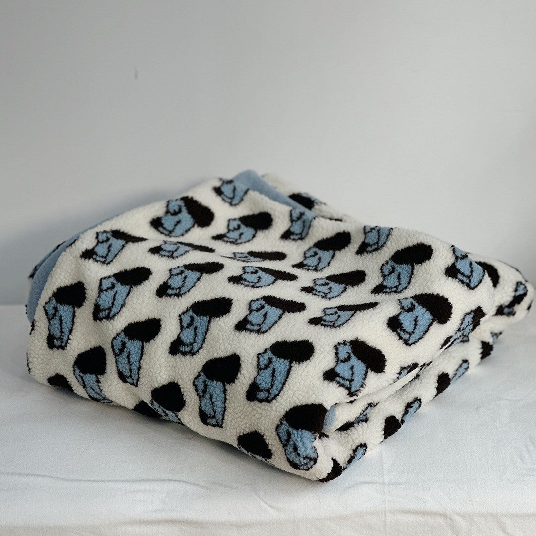 Plush Sherpa throw blanket with abstract pattern and extra-soft teddy fleece