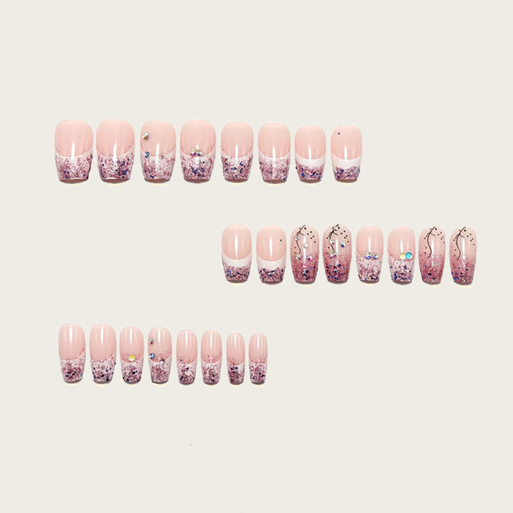 Glamorous artificial nails with glitter and rhinestone embellishments Kalsten