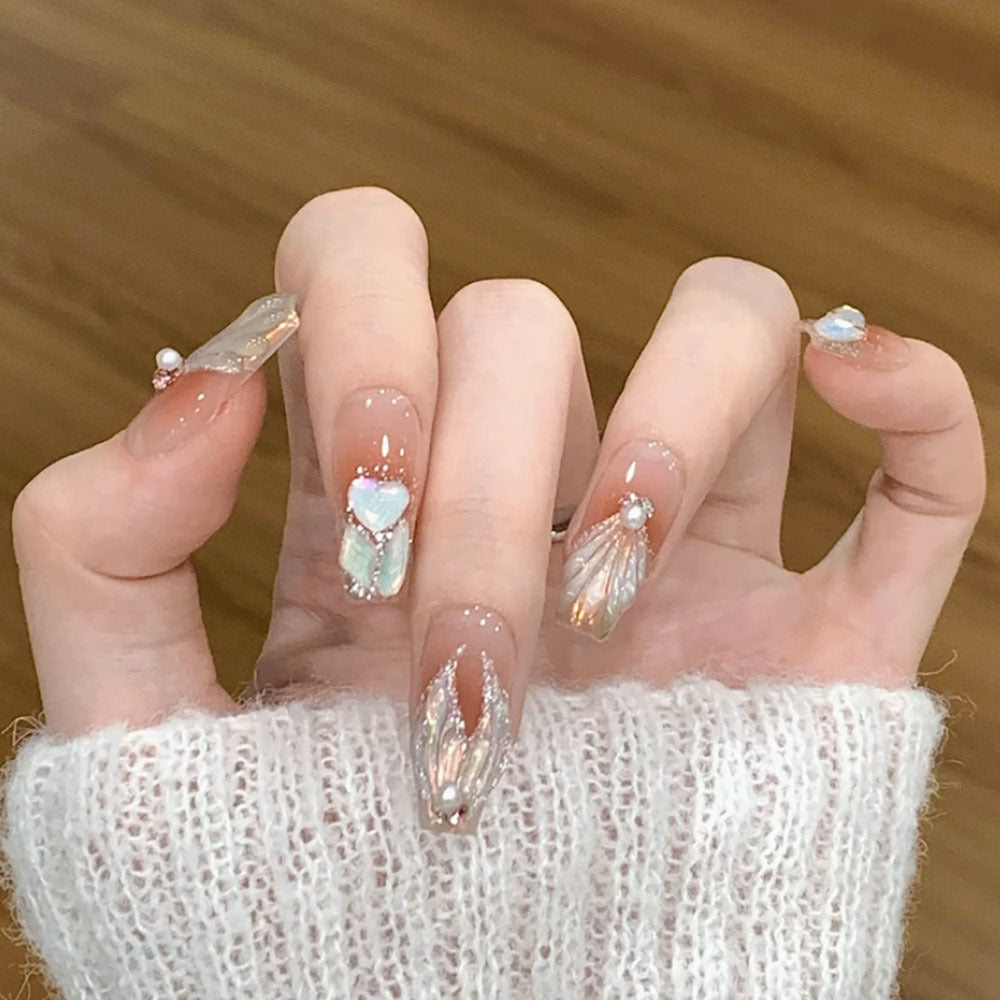 Decorative Press-On Nail Art with Pearl Accents and Shell Design
