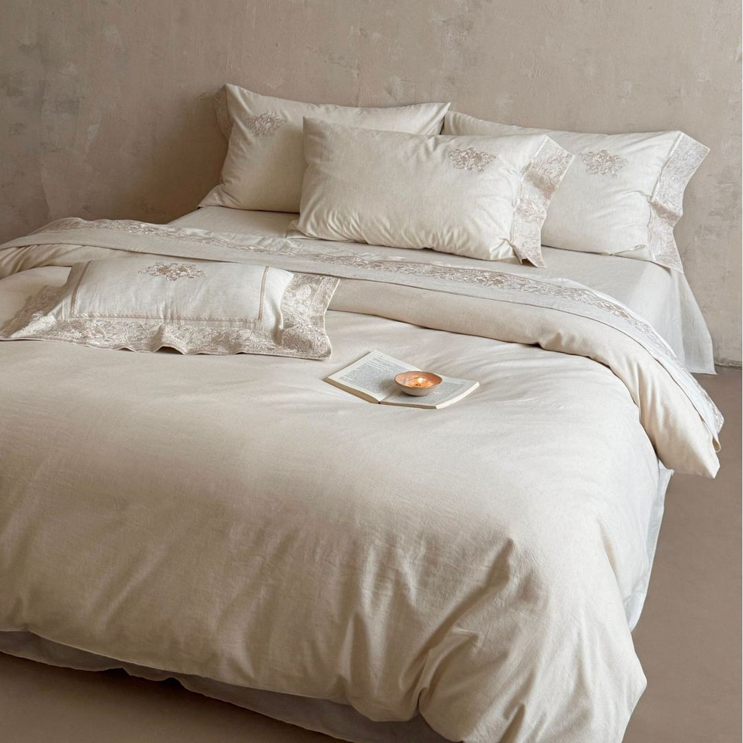Fine linen bed linen set with floral tone-on-tone embroidery and hem detail
