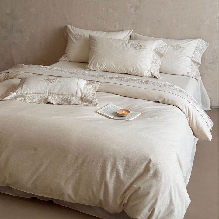 Fine linen bed linen set with floral tone-on-tone embroidery and hem detail
