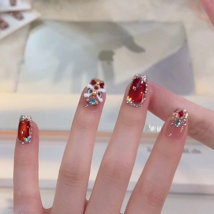 Artificial nails with glitter and gemstone applications Kalsten