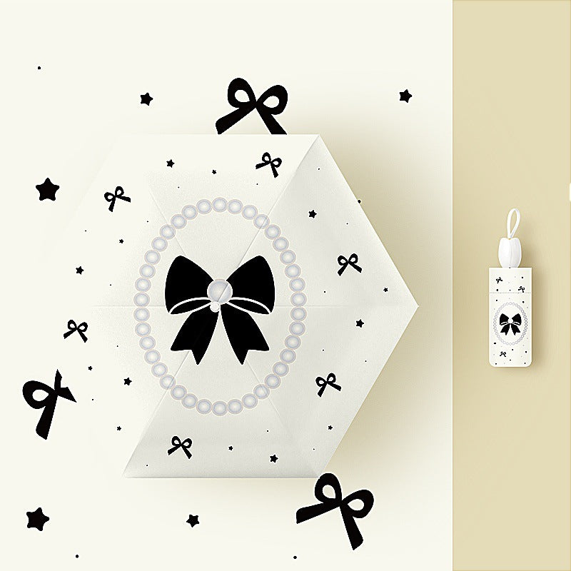 Ladies folding umbrella with playful flower design Kalsten