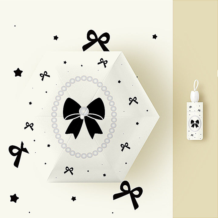 Ladies folding umbrella with playful flower design Kalsten