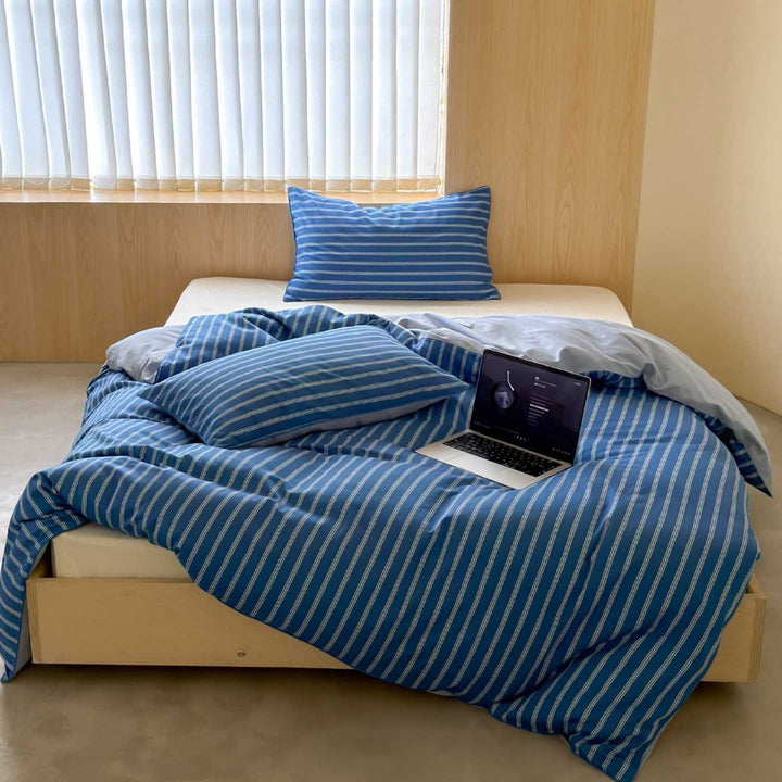 Striped cotton percale bedding set with breathable, wrinkle-free finish and concealed hotel closure