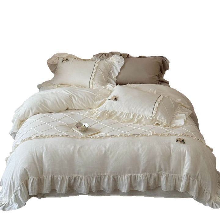 Country house style bedding set with quilted center piece, ruffle and rose appliqué