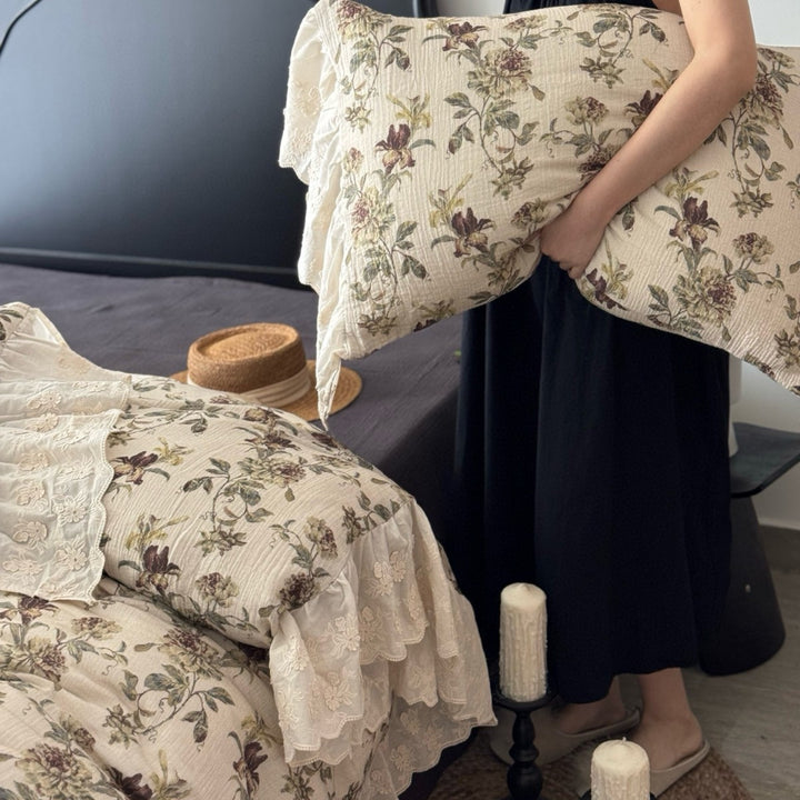 Floral quilted comfort bedspread with lace trim and decorative ruffle
