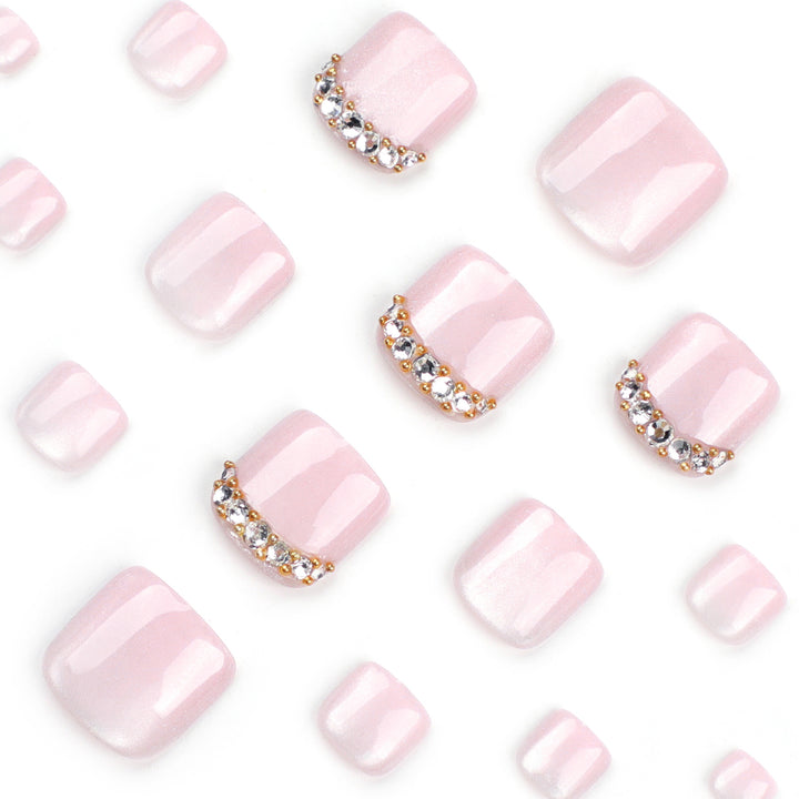 Artful toenail art with glitter and rhinestone decorations Kalsten