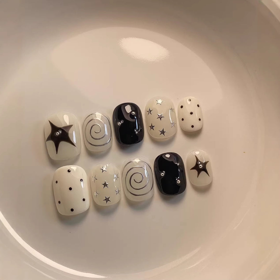 Artistic Press-On Nail Set with Star and Swirl Designs