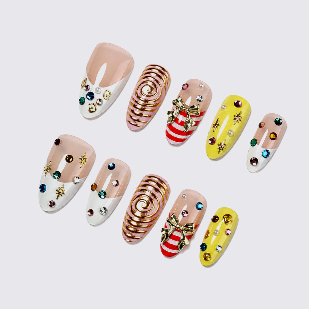 Glamorous artificial nail set with playful designs and sparkling accents Kalsten