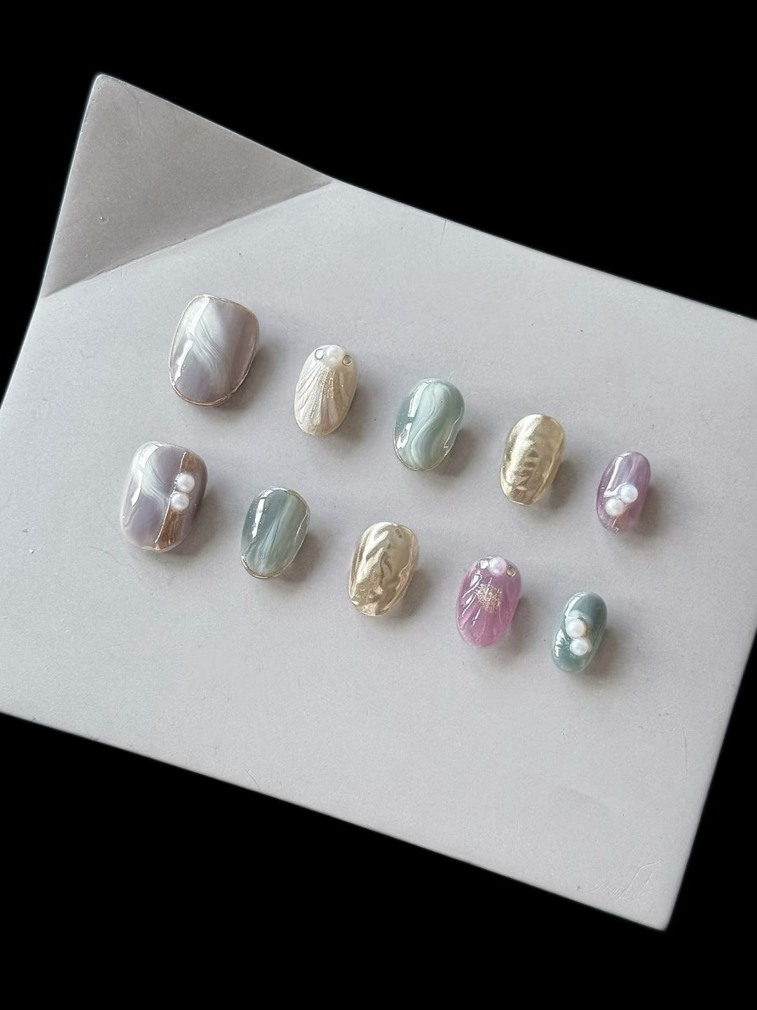 Artistic Press-On Nail Set with Natural Marble Designs