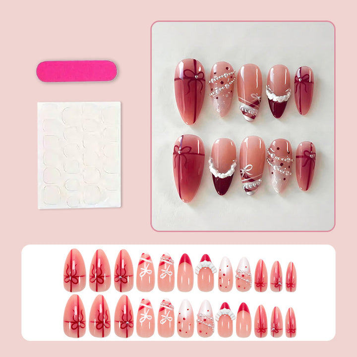 Nail set with glamorous bows and elegant pearl embellishments Kalsten