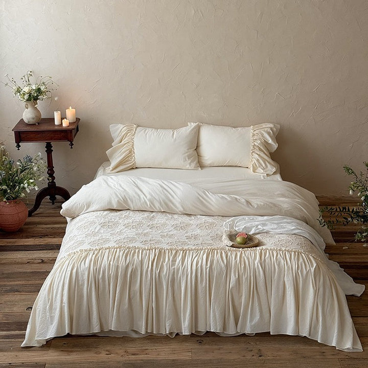 Vintage-inspired bed skirt and bedspread with wide ruffle and delicate embroidery