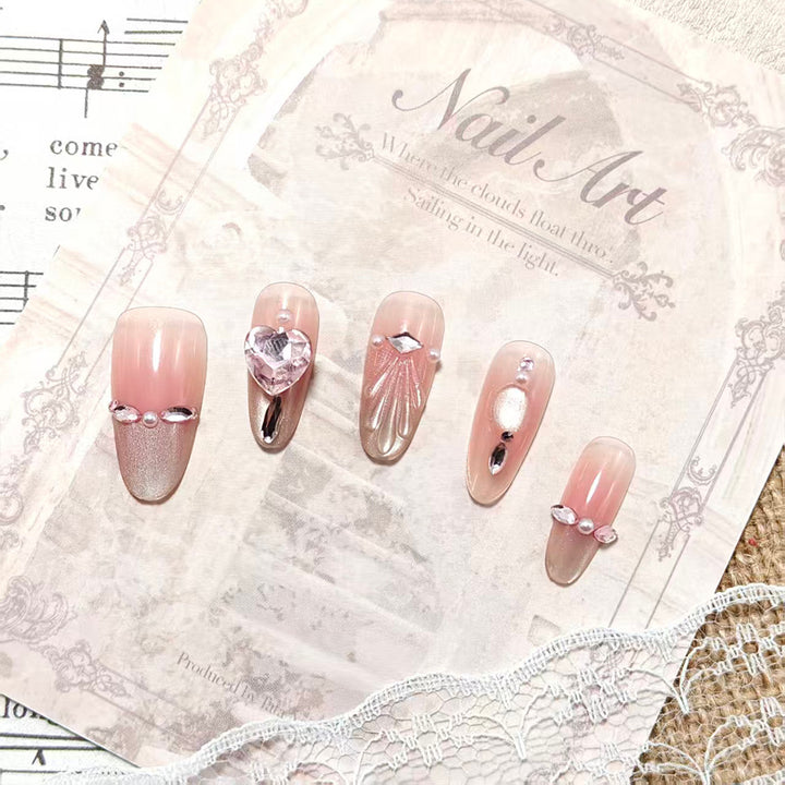 Artificial nails with sparkling heart and rhinestone accents Kalsten