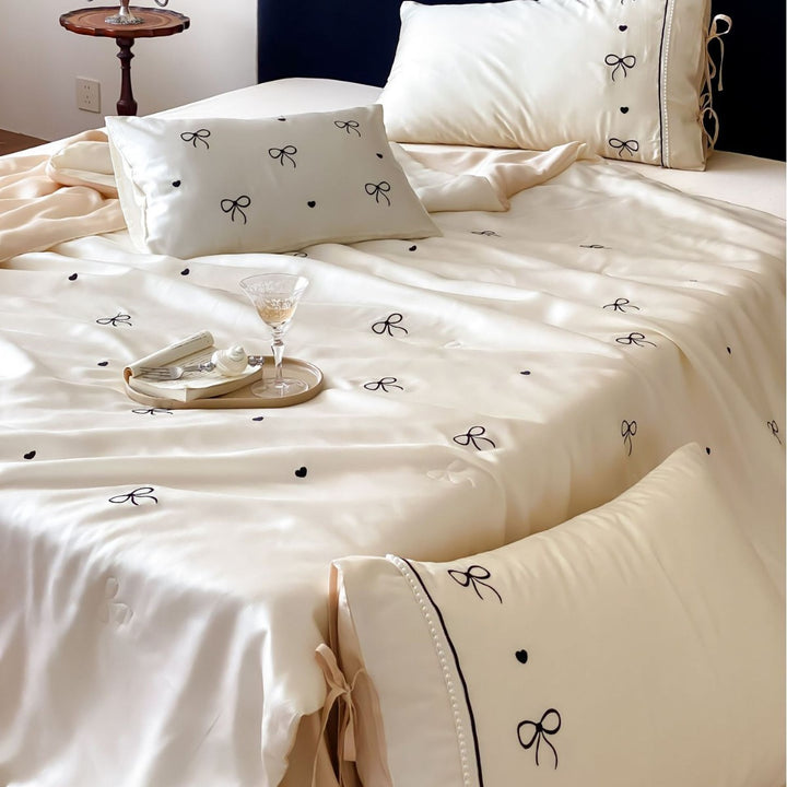Fine silk look cotton satin bed linen set with delicate ribbon embroidery and ties