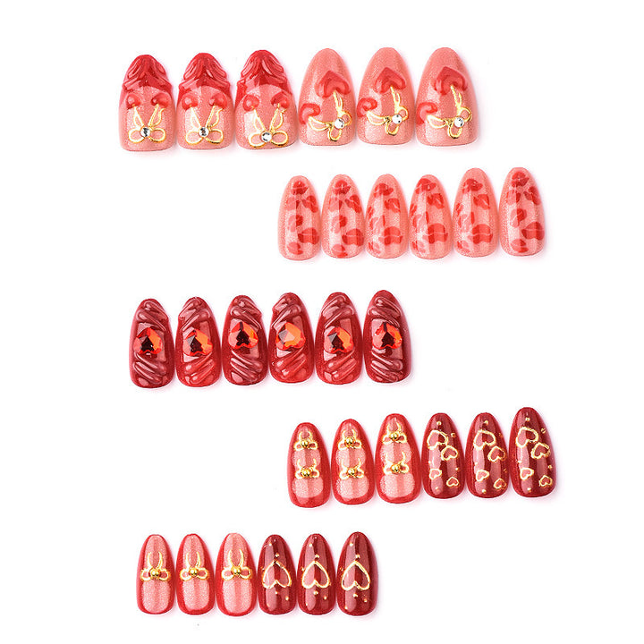 Festive artificial nails with romantic heart designs Kalsten