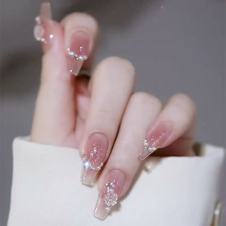 Artificial nails with glitter accents and playful motifs Kalsten