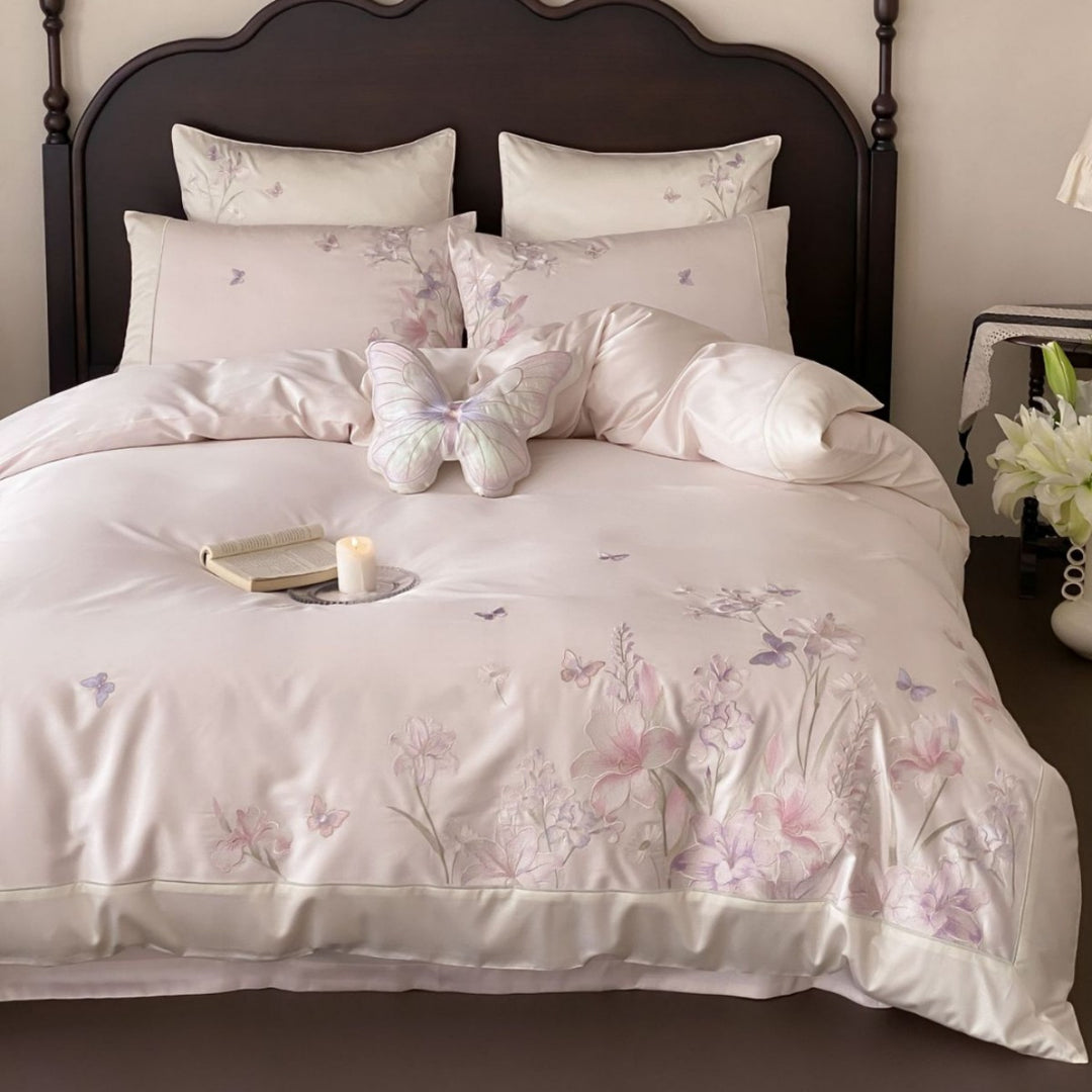 Luxurious satin bedding set with floral embroidery and butterfly appliqué