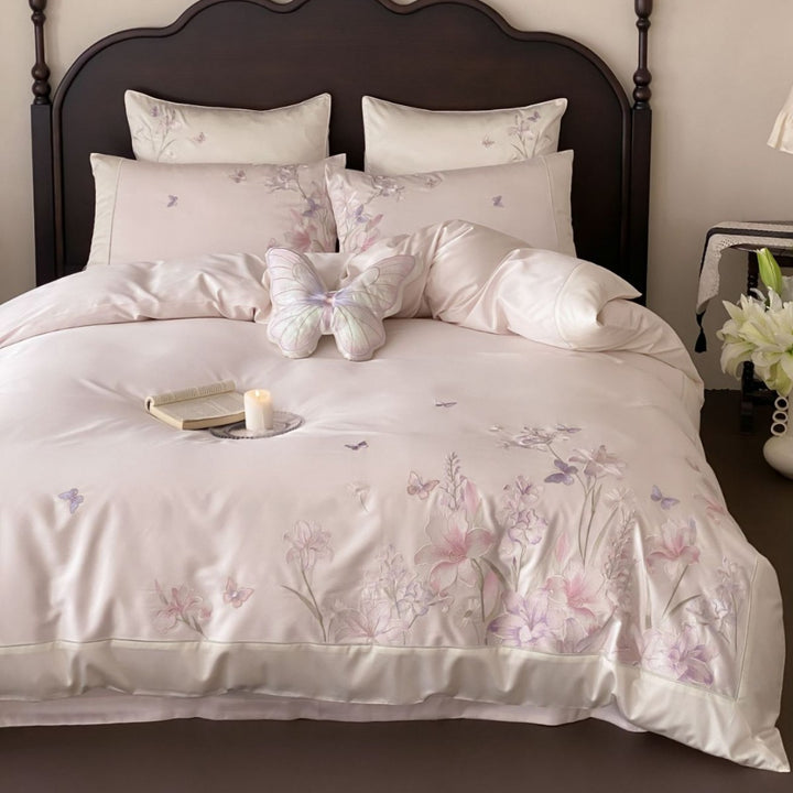 Luxurious satin bedding set with floral embroidery and butterfly appliqué
