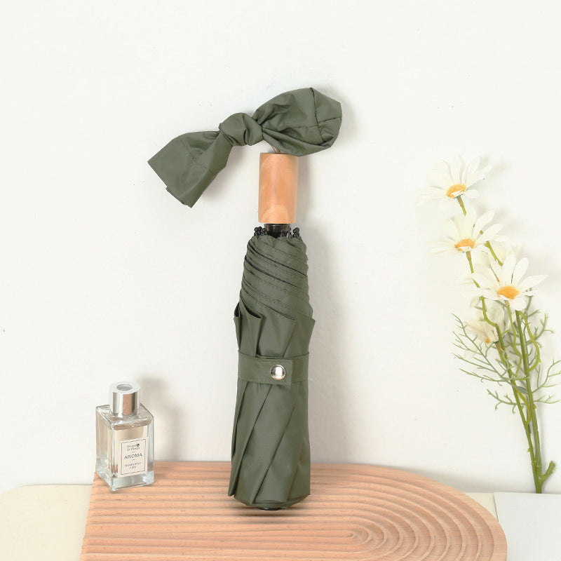 Ladies compact folding umbrella with elegant design and ergonomic wooden handle Kalsten