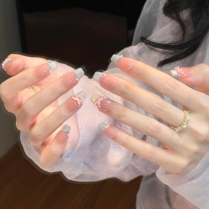 Elegant French Tip Nail Extensions with Floral Accents