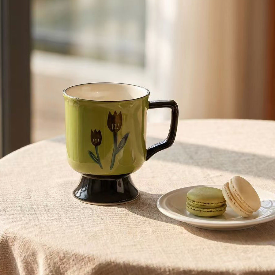 Ceramic cup with foot and hand-painted tulip motif