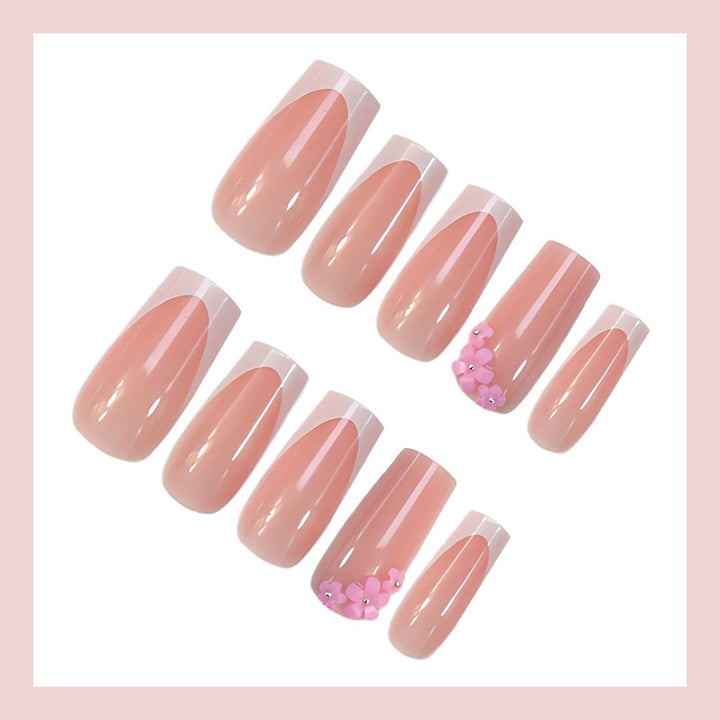 Acrylic nail set with elegant French tips and decorative accents Kalsten