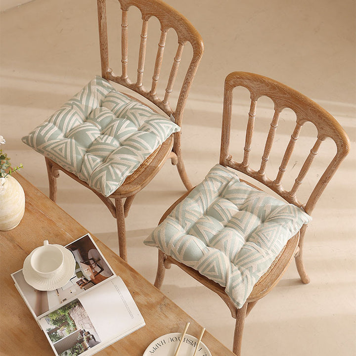 Padded quilted seat cushion with colorful button applications and non-slip underside Kalsten