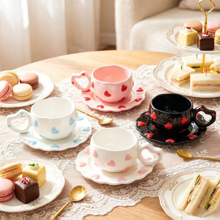 Porcelain cup set with heart-shaped handle and embossed decorative hearts