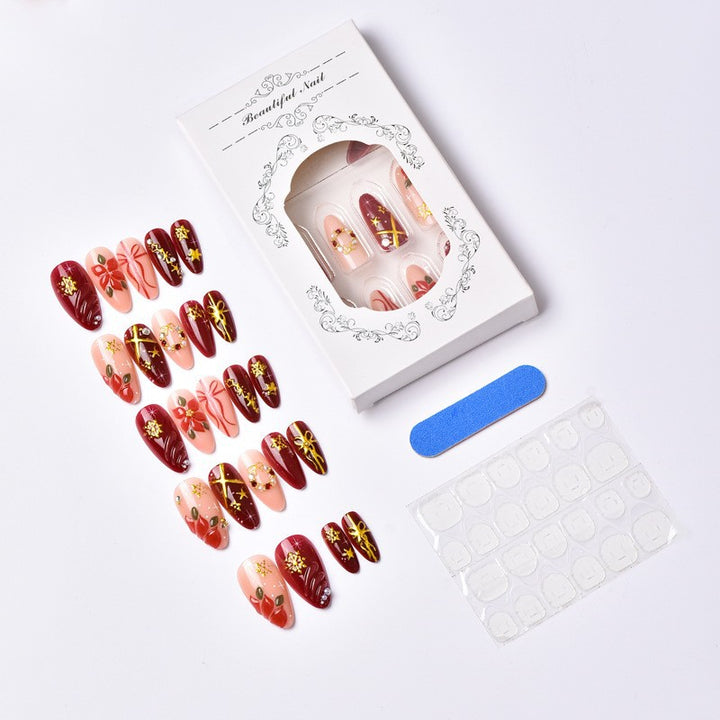 Artificial nail set with luxurious Christmas designs and glamorous accents Kalsten