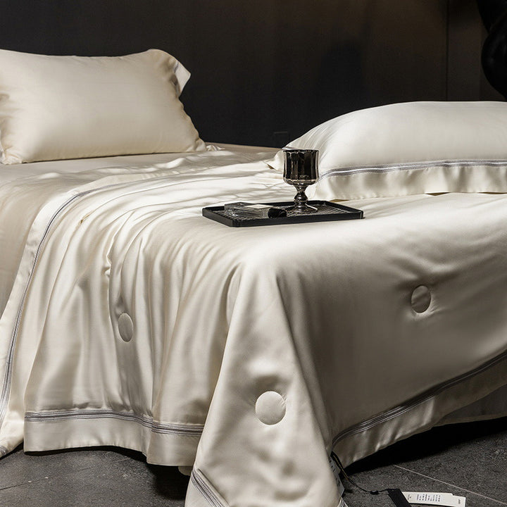 Luxurious satin bed set with silk-like surface and fine decorative stitching