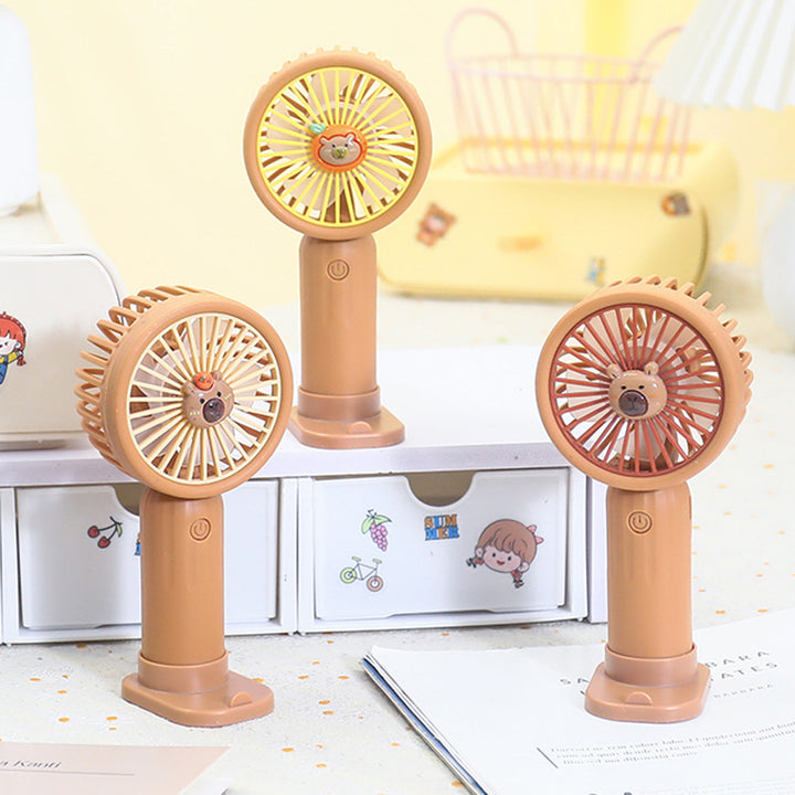Unisex portable rechargeable hand fan with integrated stand and cute bear design Kalsten